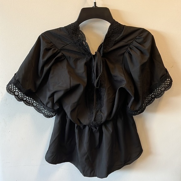 Black top with lace sleeves and neckline. Women’s size medium - Picture 2 of 2